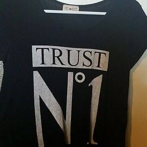 Black shirt w/ phrase stamp on the front